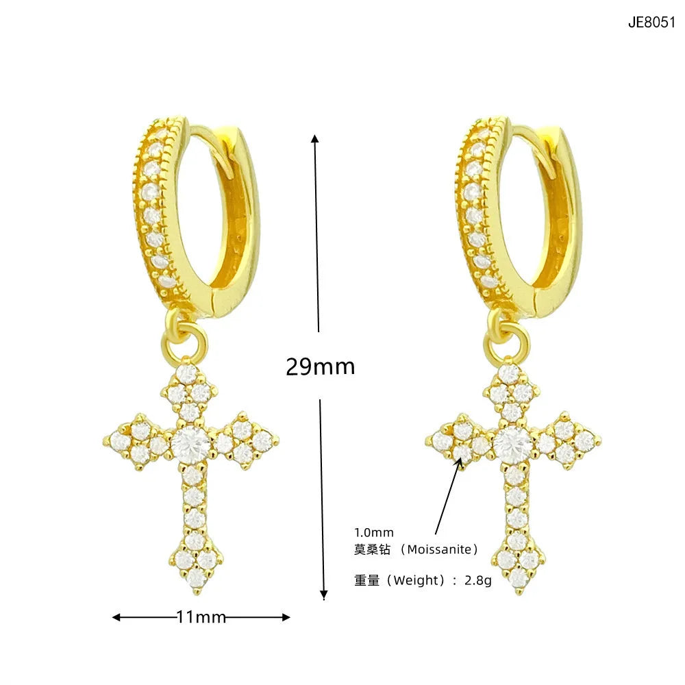 Sterling silver cross earrings worn by model, unisex style