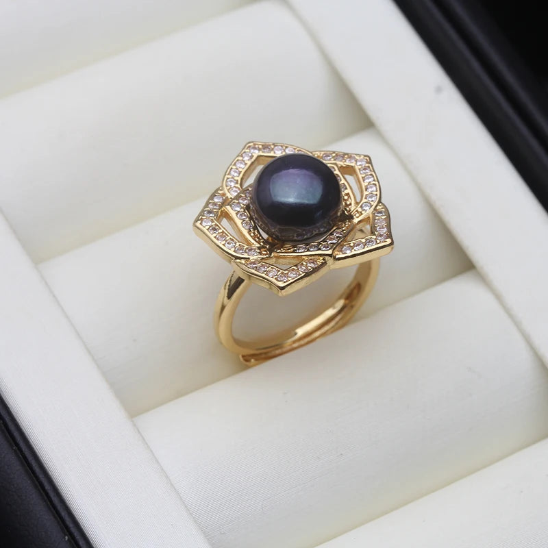 Woman wearing silver pearl ring on finger