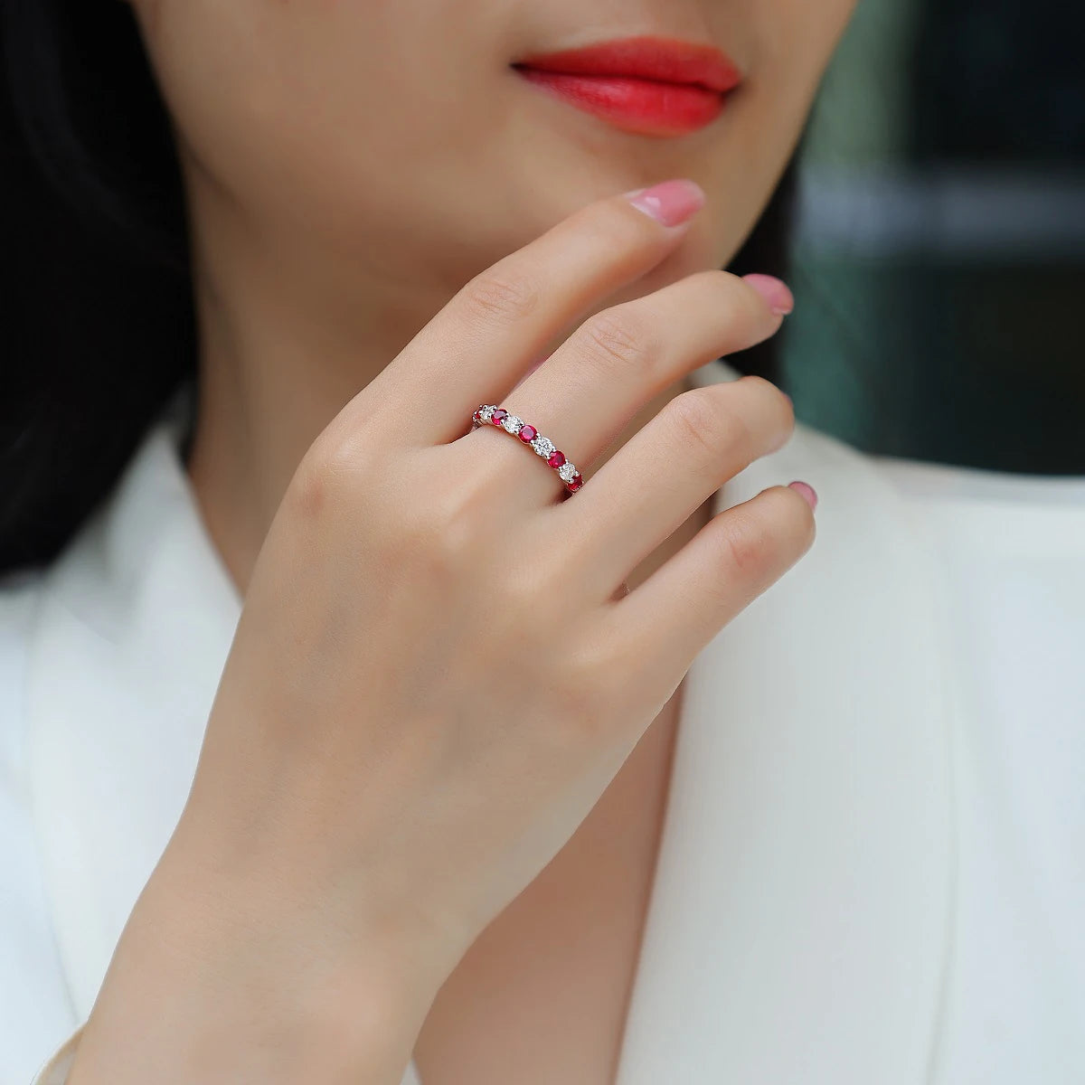 Close up of alternating ruby and moissanite gemstones