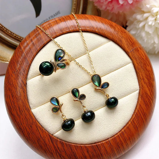 Complete abalone shell and freshwater pearl jewelry set with pendant, earrings, and ring

