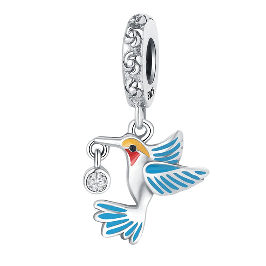 Sterling silver phoenix charm holding a bead, fantasy jewelry

