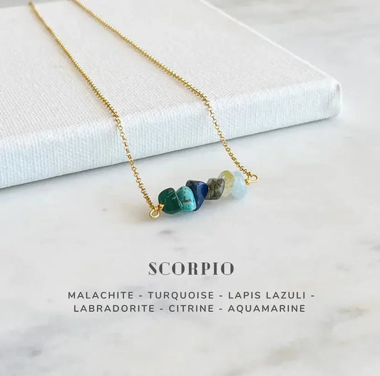 Scorpio crystal necklace on black background

