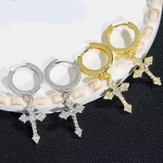 Close-up of moissanite D color cross earrings in white gold plating

