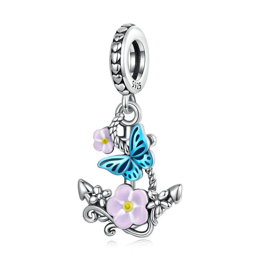 Sterling silver cross charm with butterfly and flower design

