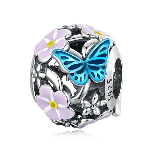 Sterling silver charm bead with white daisy and blue butterfly