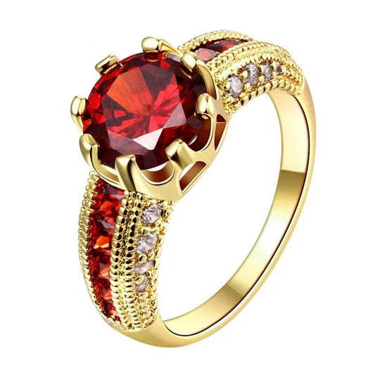 Close-up of 18K yellow gold princess ruby engagement ring

